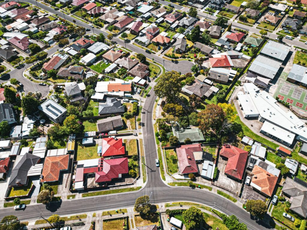 Aerial view of Melbourne suburban houses and streets, illustrating rentvesting in Melbourne in 2026